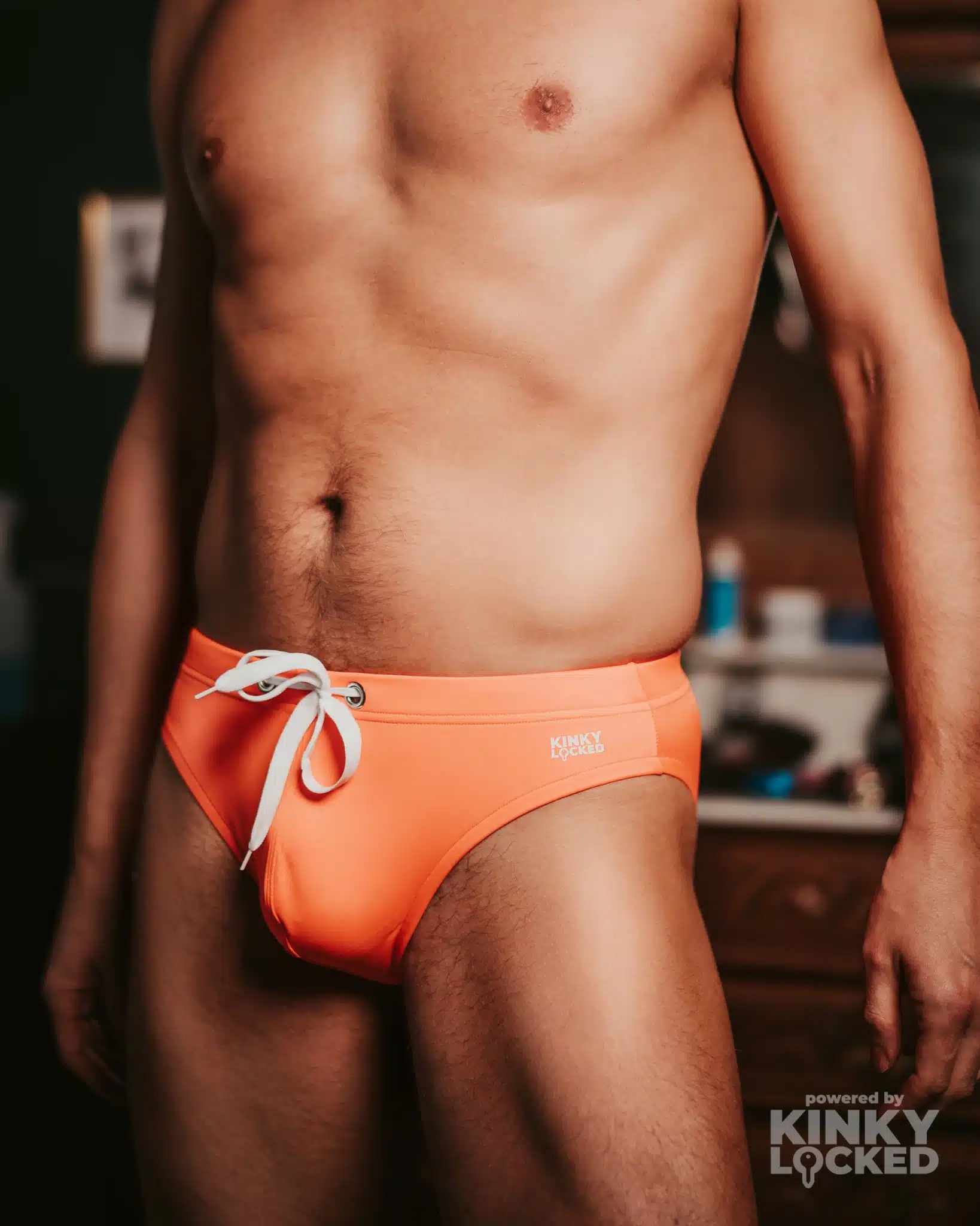 Gay Speedo 3 Confident gay man posing in a lycra speedo, celebrating the sleek texture and form-fitting design.