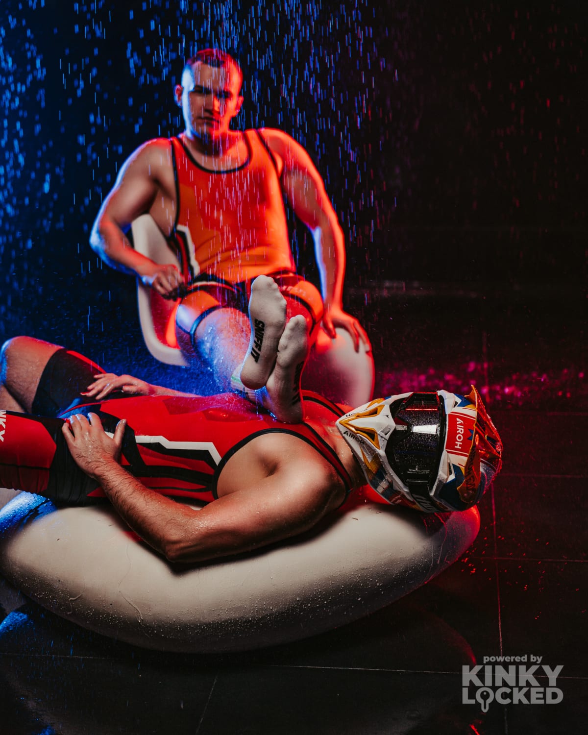 Dominant Red Wrestling Singlet under dramatic club lighting