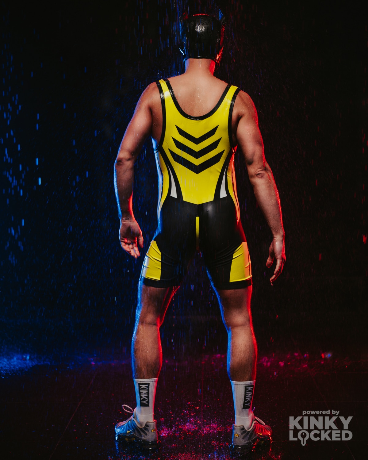 Rear full-body view of the High-Voltage Yellow Wrestling Singlet after dark