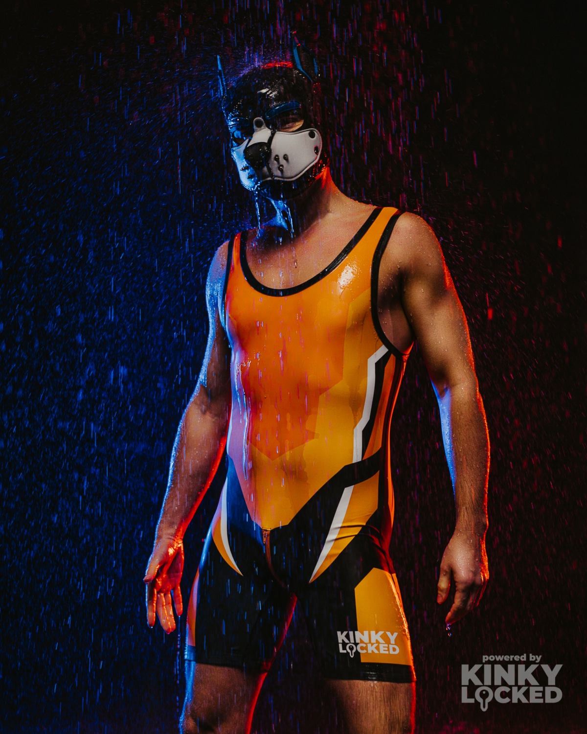 KINKY LOCKED Burning Orange Wrestling Singlet under dramatic club lighting