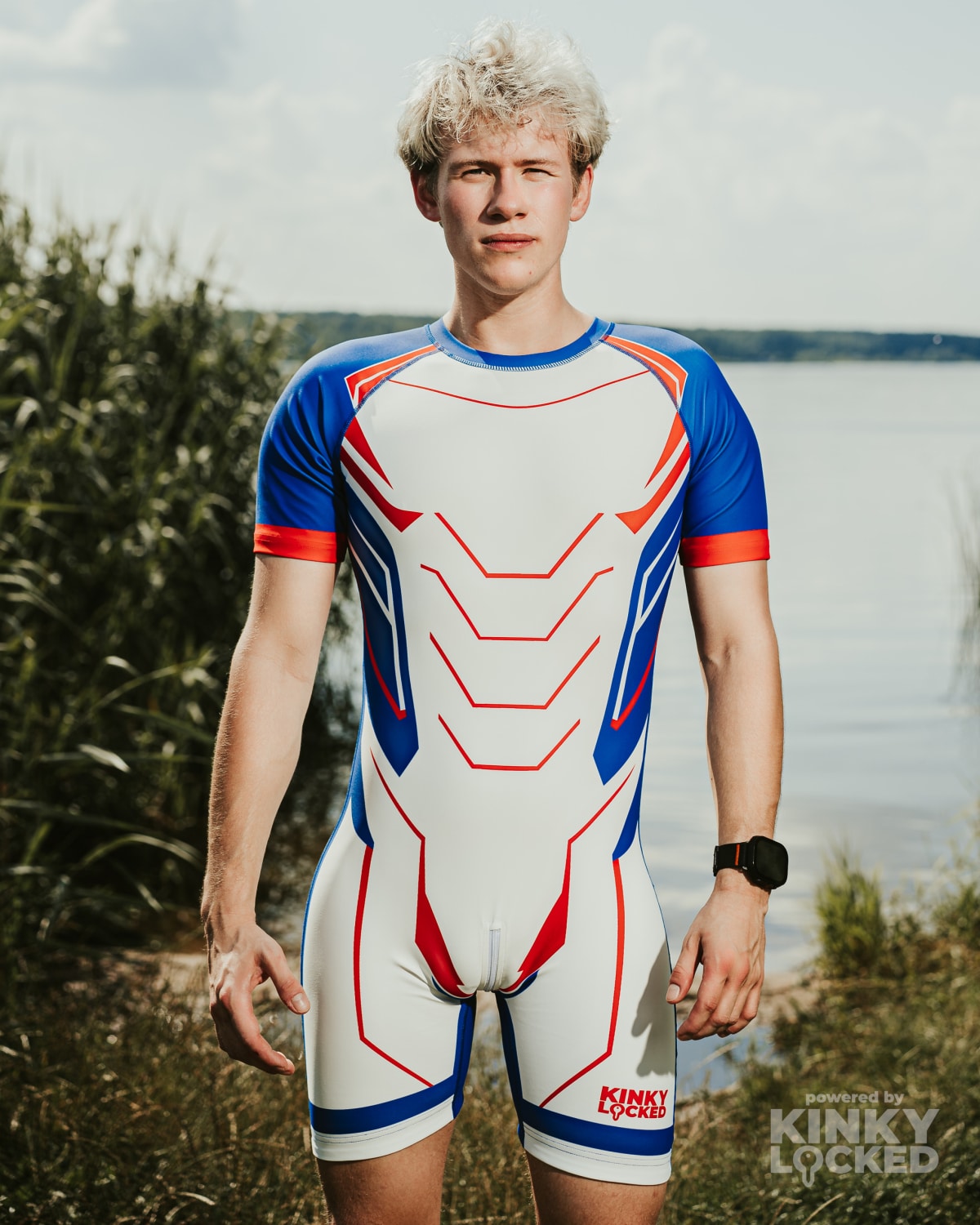 Front view of KINKY LOCKED Fusion White Surfsuit by the water