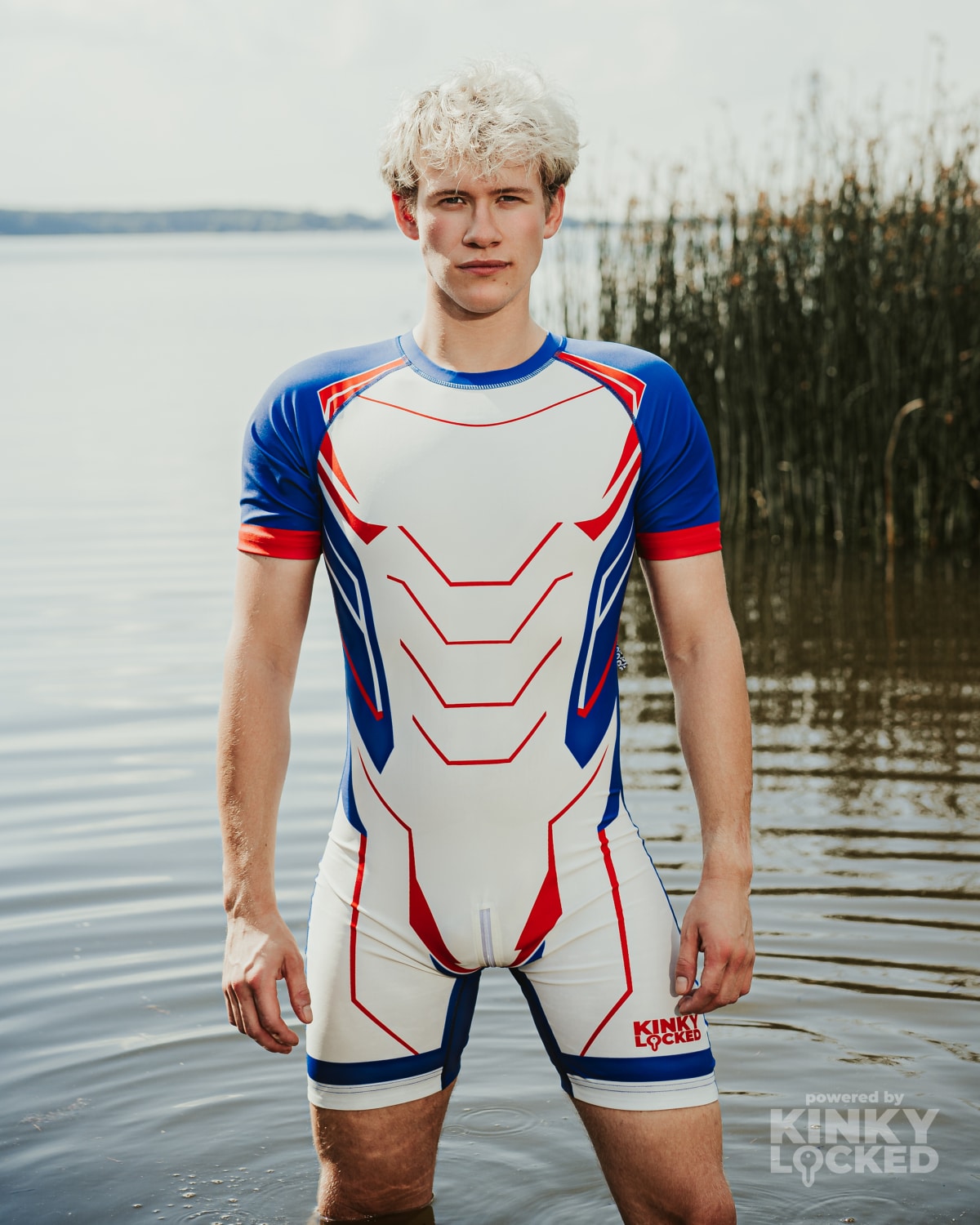 KINKY LOCKED Fusion White Surfsuit standing in the water