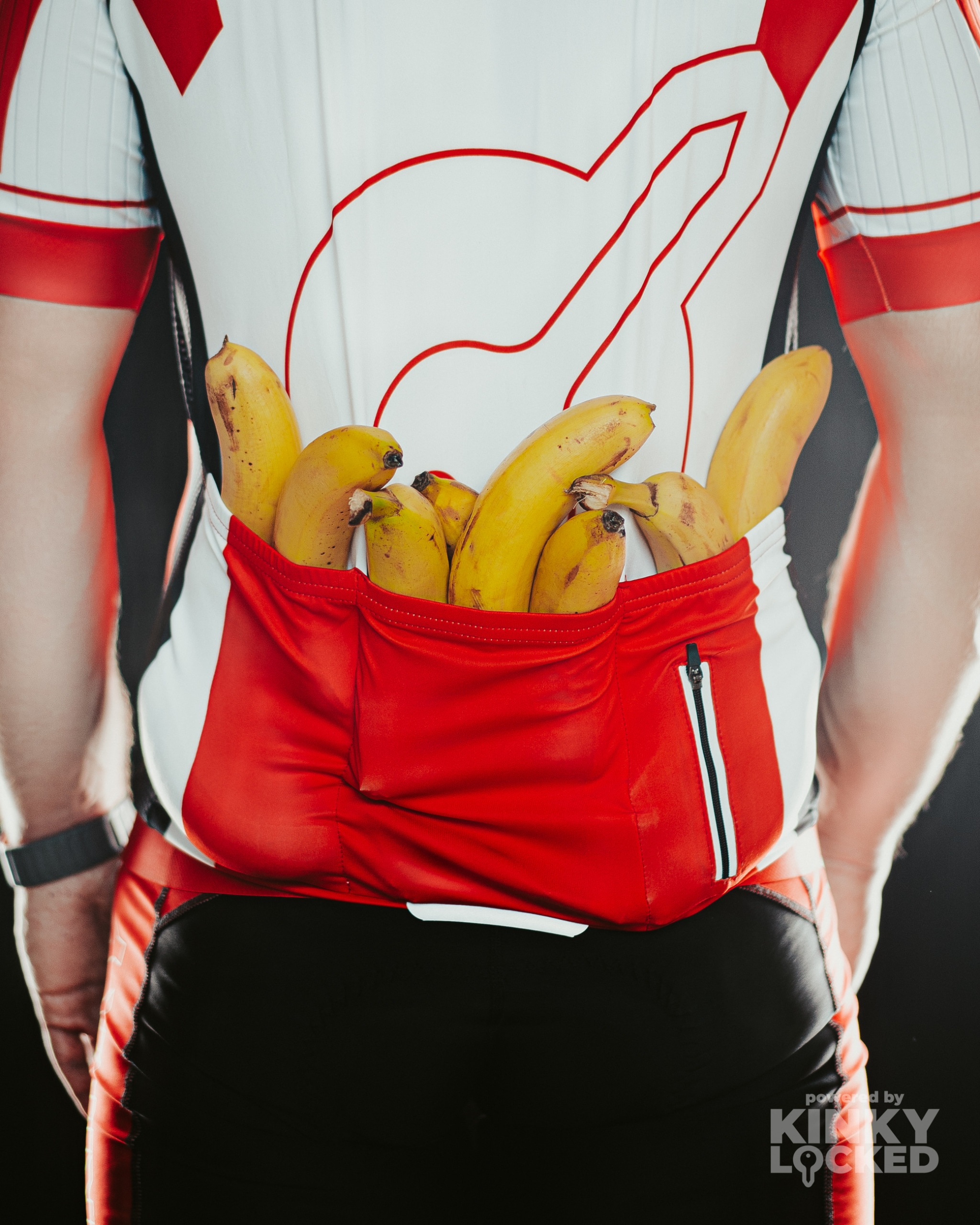 Rear of cycling jersey showing three cargo pockets and one zippered pocket